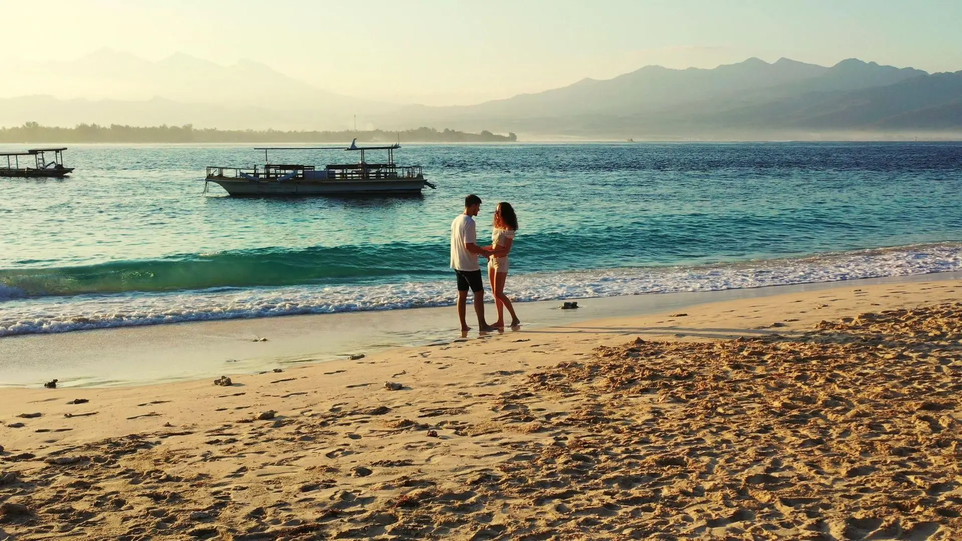 Couple in love enjoying summer vacations on exotic beach